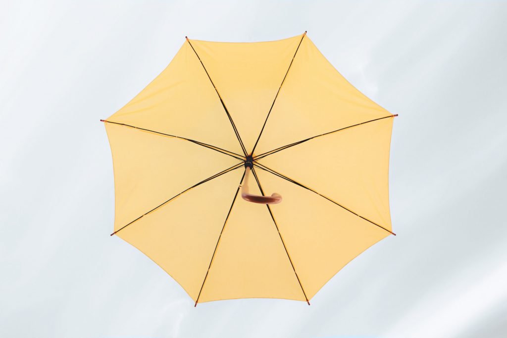 A yellow umbrella in the sky